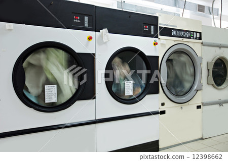 Running washing machines in laundry room Running washing machines in laundry room 12398662