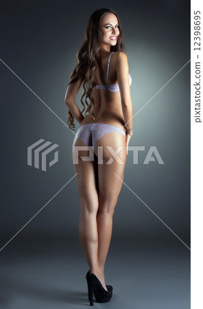 Charming young woman advertises erotic underwear 12398695