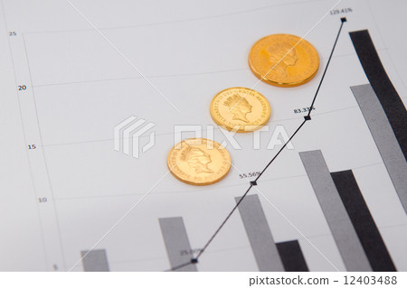 Gold coins on financial chart 12403488