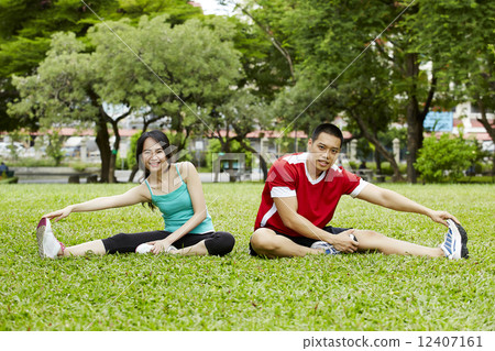 Happy couple training in the park - Fitness activety Happy couple training in the park - Fitness activety 12407161