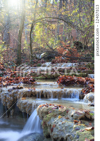 Waterfall in autumn forest 12407813