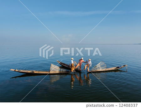 Burmese fisherman at Inle lake, Myanmar Burmese fisherman at Inle lake, Myanmar 12408337