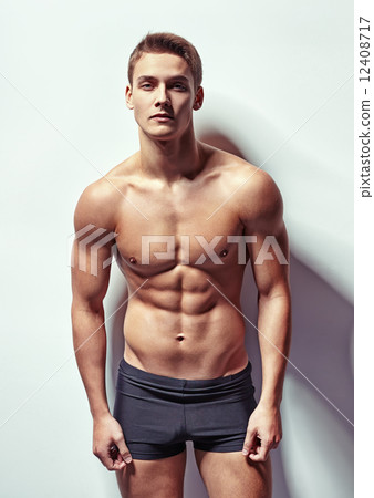 Portrait of a young sexy muscular man 12408717