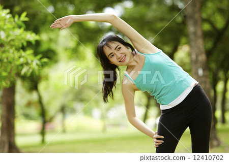 Close up stretching woman in outdoor exercise smiling happy doin Close up stretching woman in outdoor exercise smiling happy doin 12410702