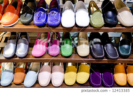 variety of the colorful leather shoes in the shop 12413385
