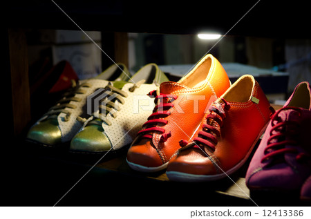 variety of the colorful leather shoes in the shop 12413386