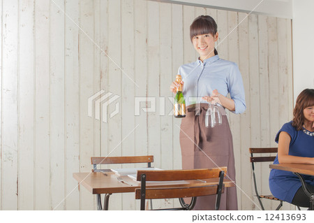 A woman preparing a table A woman preparing a table 12413693