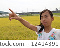 Girl pointing 12414391