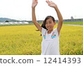 A girl waving a hand 12414393