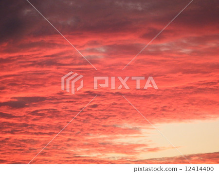 The sky of a sunset glowing red sky clouds. 12414400