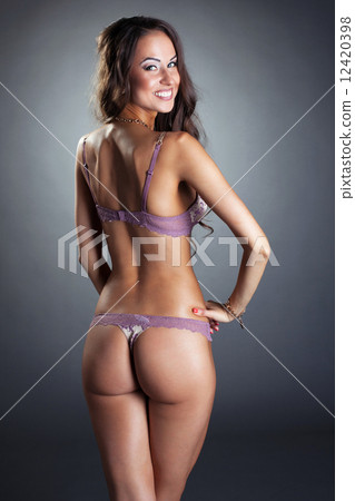 Charming woman in lingerie posing back to camera Charming woman in lingerie posing back to camera 12420398
