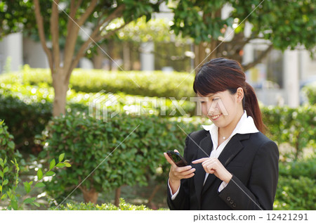 A woman with a smartphone 12421291