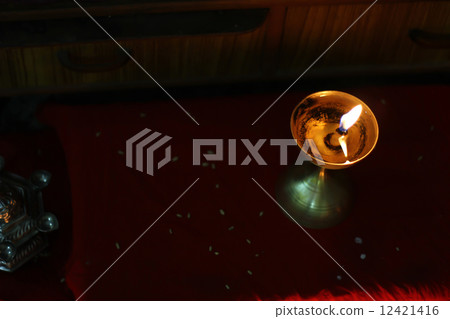 metallic oil lamp lit on deepawali 12421416
