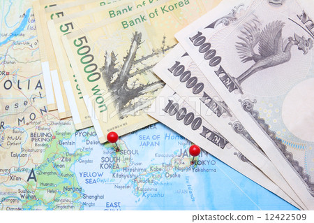 South Korean Won and Japanese Yen with pin on map 12422509