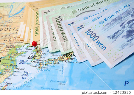 Korean bank notes with pin on map 12423830