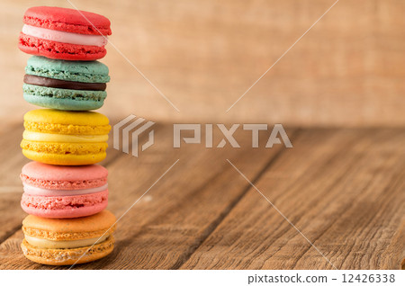 french colorful macarons on a wooden floor french colorful macarons on a wooden floor 12426338
