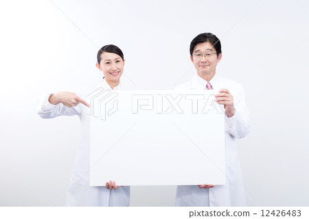 Doctor and nurse message finger pointing Doctor and nurse message finger pointing 12426483