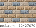 Decorative wall covered with colourful tiles 12427070