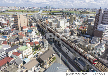 Keisei Line train running in residential area 12427271