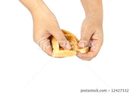 Hand holding waffle 12427332
