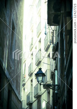 vintage shoot of a narrow alley in barcelona vintage shoot of a narrow alley in barcelona 12427723