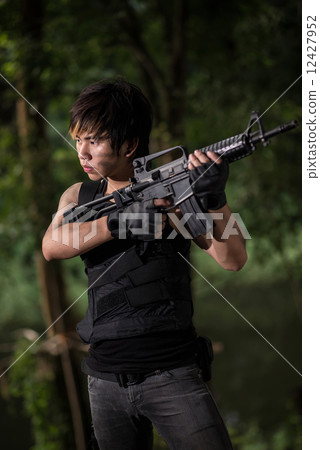 Special force with the gun in the jungle Special force with the gun in the jungle 12427952