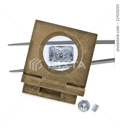 vintage loupe over diamond and tweezers vintage loupe over diamond and tweezers 12428203