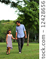 Asian Father and daughter enjoying a stroll at the park 12428656
