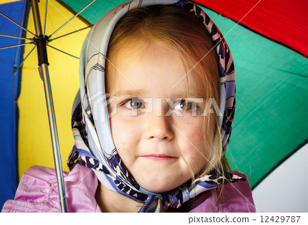 Cute little girl with colorful umbrella Cute little girl with colorful umbrella 12429787