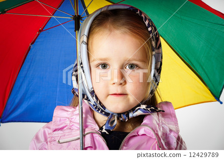 Cute little girl with colorful umbrella Cute little girl with colorful umbrella 12429789