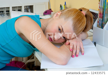 teen girl making worried expression in her room 12433571