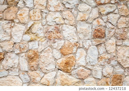 Background photo texture of yellow gray stone wall 12437218