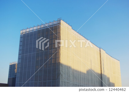 Building covered with soundproof sheet Building covered with soundproof sheet 12440462