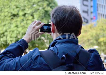 Foreign tourists taking pictures (Shibuya) 12440532