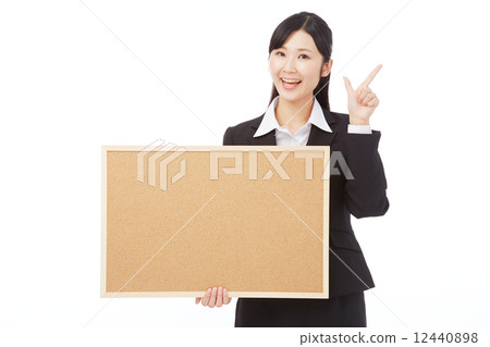 Business woman to check sign with a message board Business woman to check sign with a message board 12440898