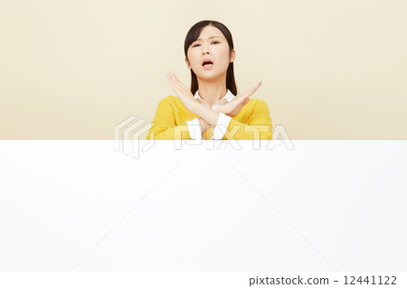 A woman crossing a message board A woman crossing a message board 12441122
