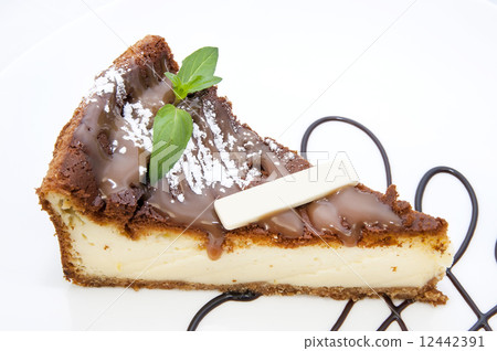 piece of cheese cake on a table in a restaurant piece of cheese cake on a table in a restaurant 12442391