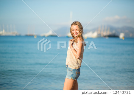 Young girl on the beach in Cannes 12443721