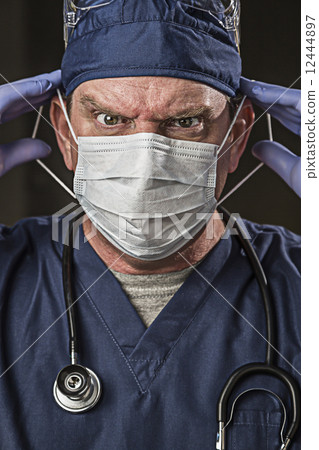 Determined Looking Doctor or Nurse with Protective Wear and Stet 12444897