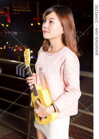 Pretty Asian woman with ukelele Pretty Asian woman with ukelele 12445292