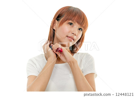 Pretty Asian Woman Brushing Hair 12448121