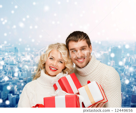 smiling man and woman with presents smiling man and woman with presents 12449656