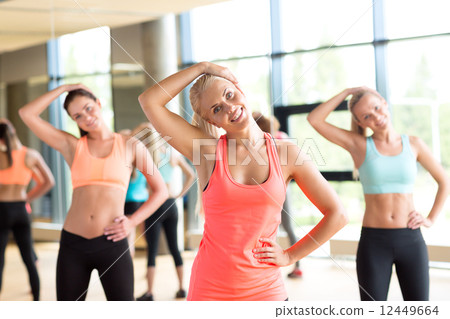 group of women working out in gym group of women working out in gym 12449664