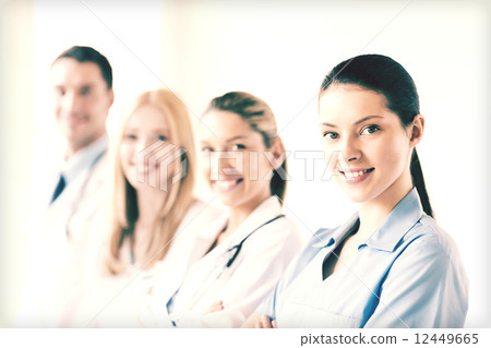 female doctor in front of medical group 12449665