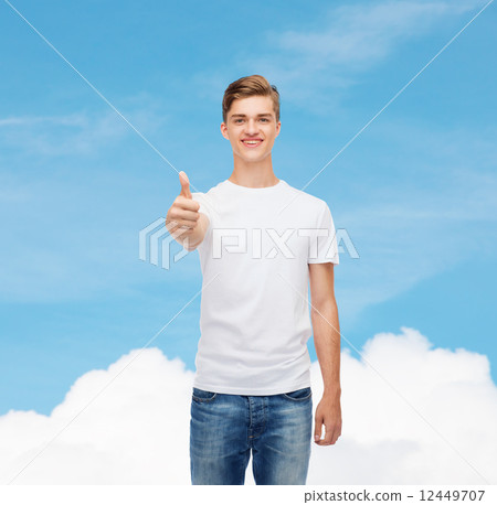 smiling man in white t-shirt showing thumbs up smiling man in white t-shirt showing thumbs up 12449707