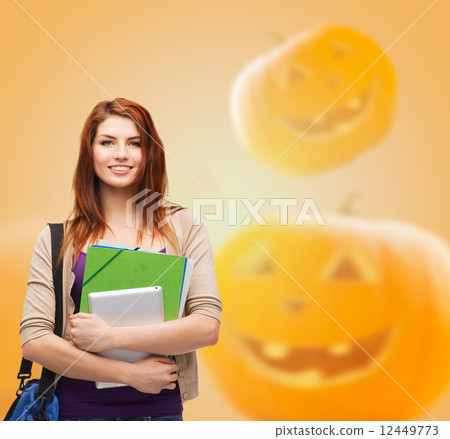 smiling student girl with books and bag 12449773