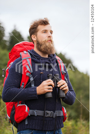 man with backpack and binocular outdoors man with backpack and binocular outdoors 12450104