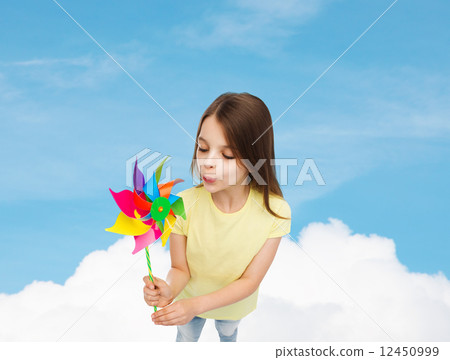 smiling child with colorful windmill toy smiling child with colorful windmill toy 12450999