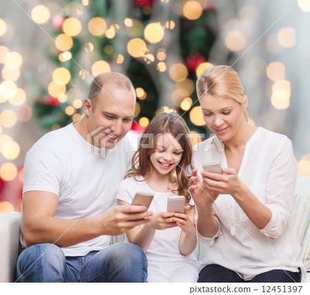 happy family with smartphones 12451397