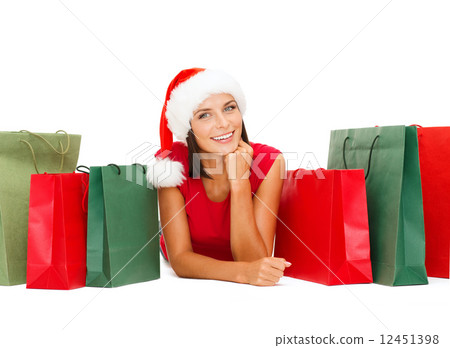 woman in red shirt with shopping bags woman in red shirt with shopping bags 12451398